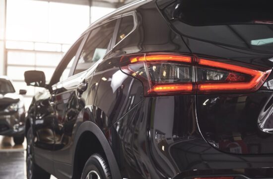 The back headlights of a black luxury car