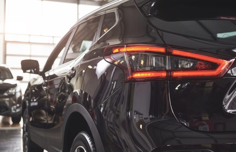 The back headlights of a black luxury car
